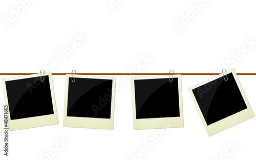 Four polaroid photos hanging on rope