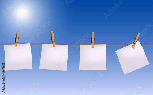 Four paper notes hanging on rope