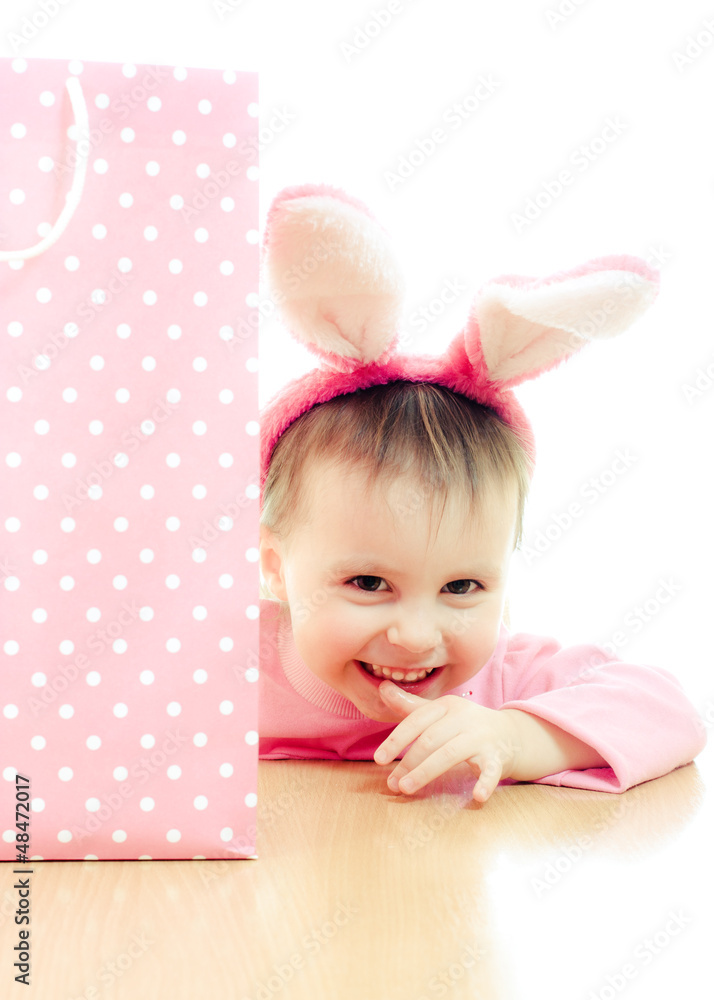 The little girl with pink ears bunny and bag.
