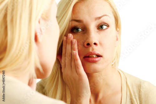 Woman caring of her beautiful skin on the face