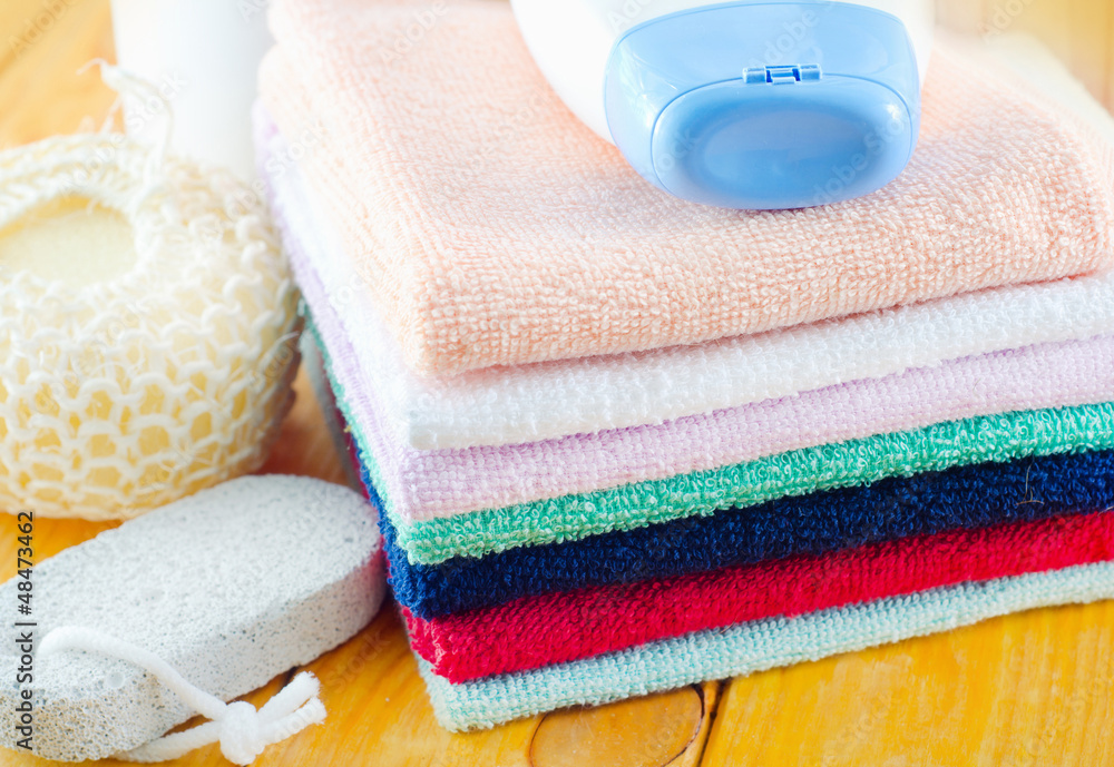 shampoo, body wash and towels