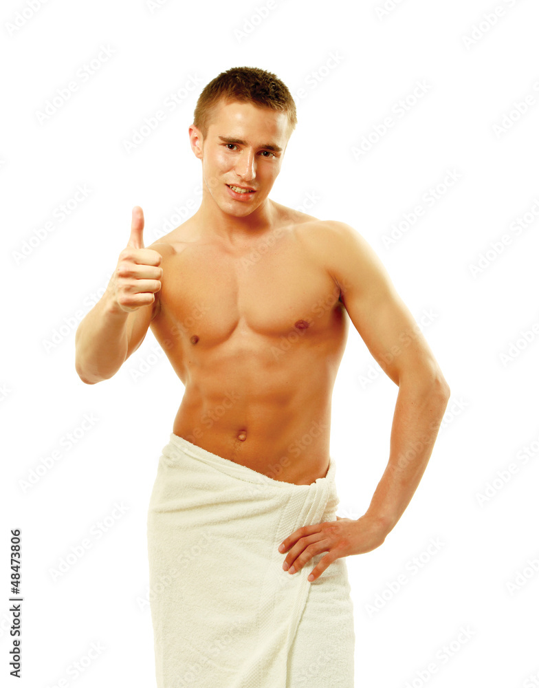 muscular man wrapped a white towel isolated on white muscular man wrapped a white towel isolated on white