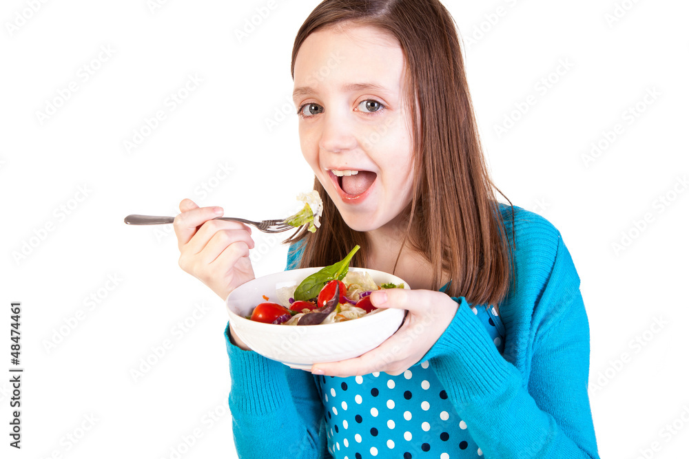 a young girl eating a healthy salad a young girl eating a healthy salad