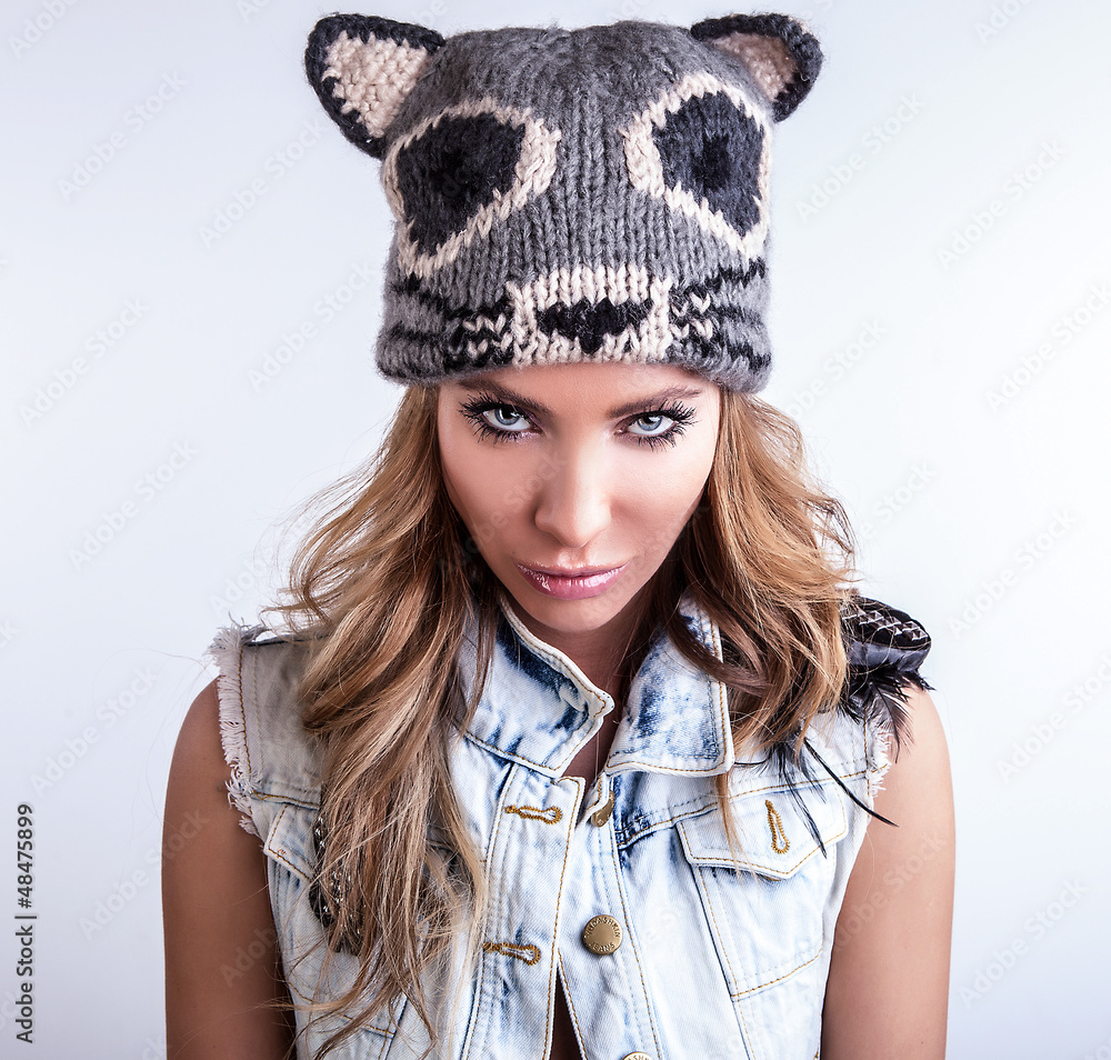 Young sensual model woman on cat hat pose in studio. Stock Photo Adobe Stock