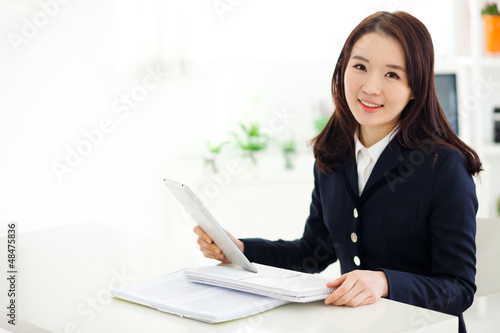 Young Asian student studying with pad PC