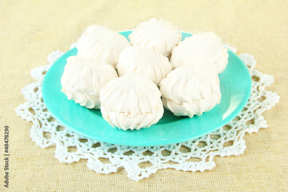 Marshmallows on color plate on light background Marshmallows on color plate on light background
