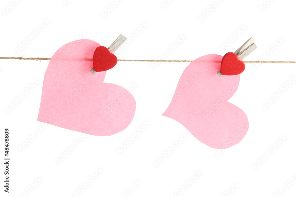 two paper hearts on rope, isolated on white two paper hearts on rope, isolated on white