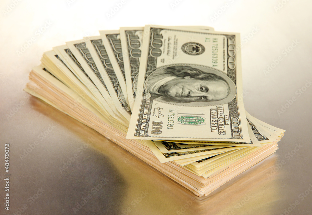 Many of one hundred dollars banknotes close-up Many of one hundred dollars banknotes close-up