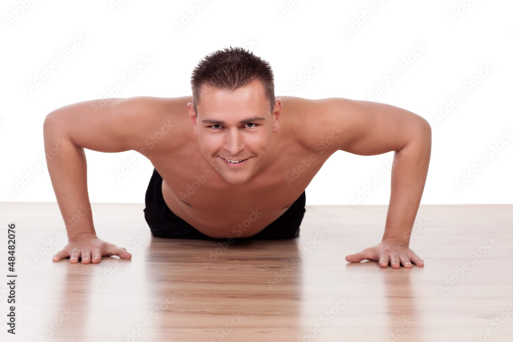 Handsome young man doing press ups Handsome young man doing press ups
