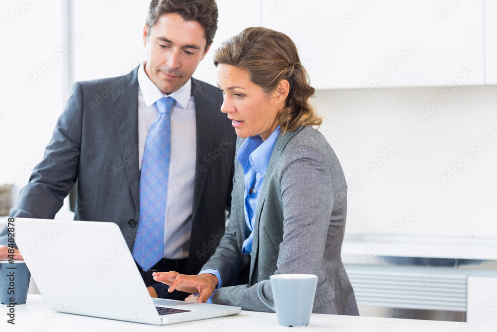 Couple using laptop before work Couple using laptop before work
