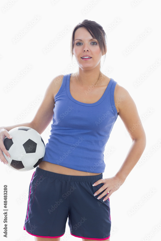 Portrait of young woman in sportswear with football Portrait of young woman in sportswear with football