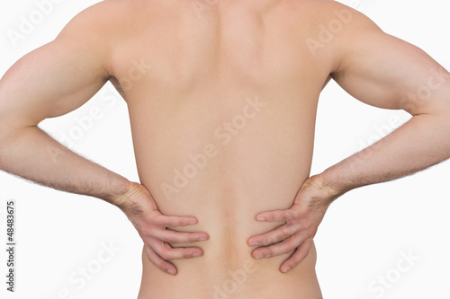 Rear view of muscular man with backache