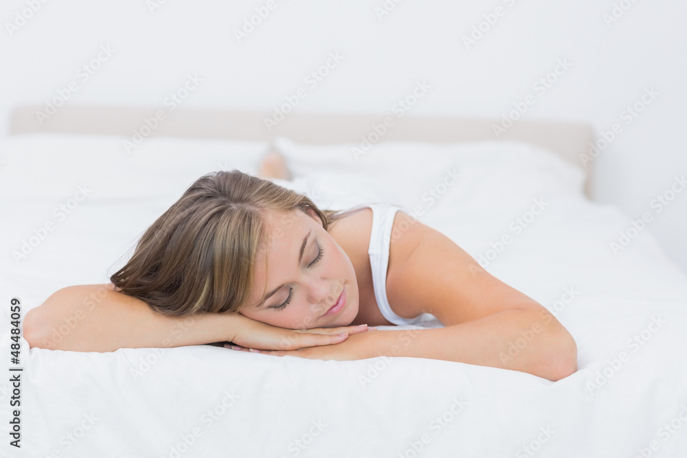 Blonde woman napping on the bed Blonde woman napping on the bed