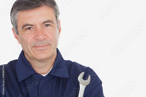 Portrait of mature machanic with wrench
