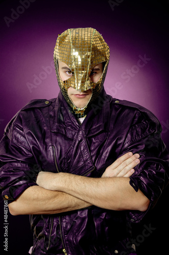 Fototapeta Naklejka Na Ścianę i Meble -  Bizarre hero in gold mask