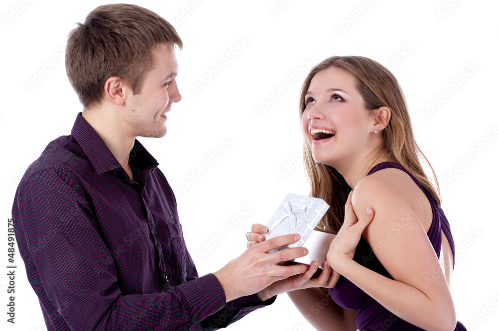 Man offering present to girlfriend on white background Man offering present to girlfriend on white background