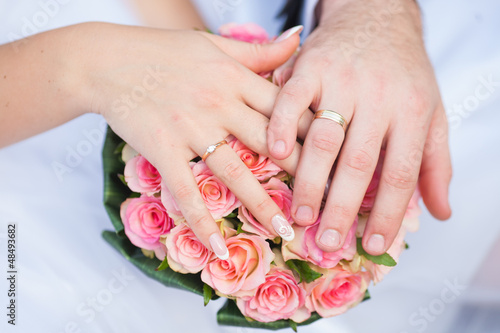 Hands and rings it is wedding bouquet