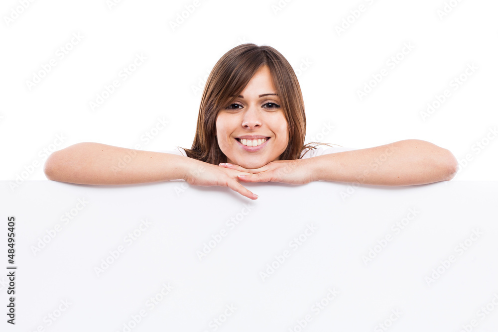 Portrait of a young woman with blank billboard Portrait of a young woman with blank billboard
