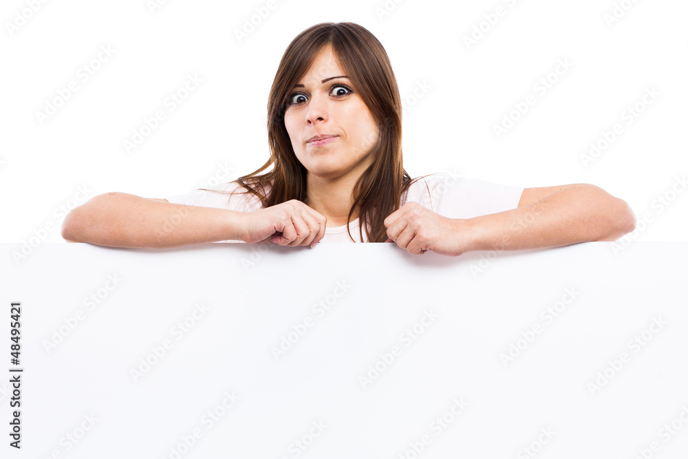 Portrait of a young woman with blank billboard Portrait of a young woman with blank billboard