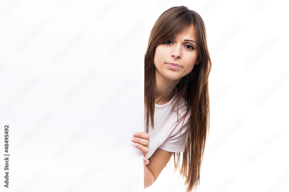 Portrait of a young woman with blank billboard Portrait of a young woman with blank billboard