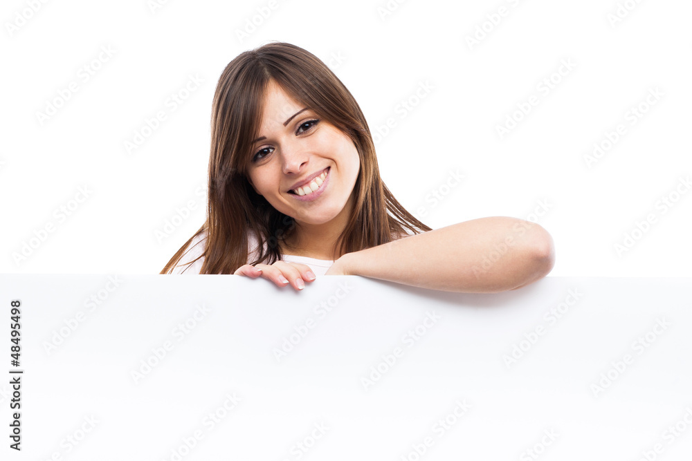Portrait of a young woman with blank billboard Portrait of a young woman with blank billboard