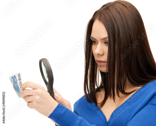 woman with magnifying glass and euro cash money