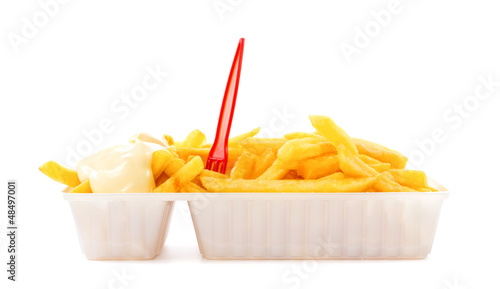 Portion of fries with mayonnaise and plastic fork