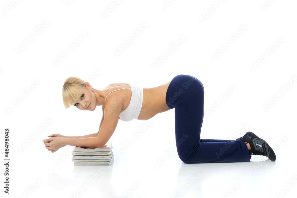 Fototapeta premium Athletic girl doing exercises