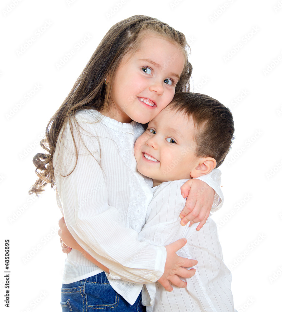 Little girl and boy hugging. Isolated on white Little girl and boy hugging. Isolated on white