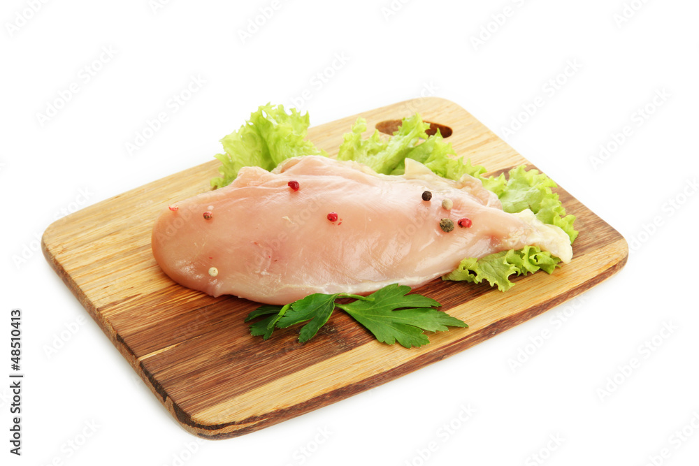 raw chicken meat on cutting board, isolated on white