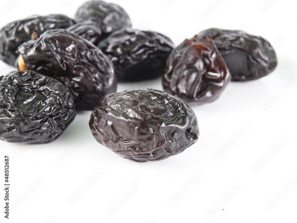 prunes on a white background prunes on a white background
