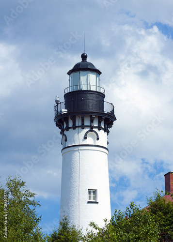 old  traditional lighthouse with cloudy sky