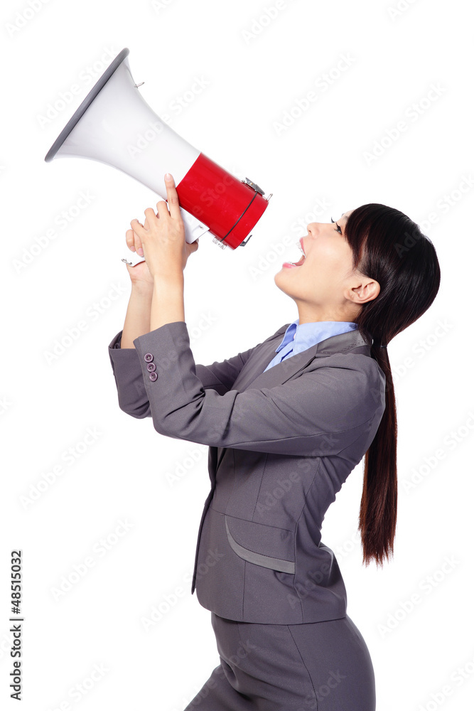 Business woman screaming in megaphone Business woman screaming in megaphone