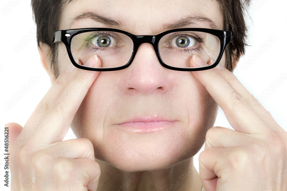 Woman holds her glasses Woman holds her glasses