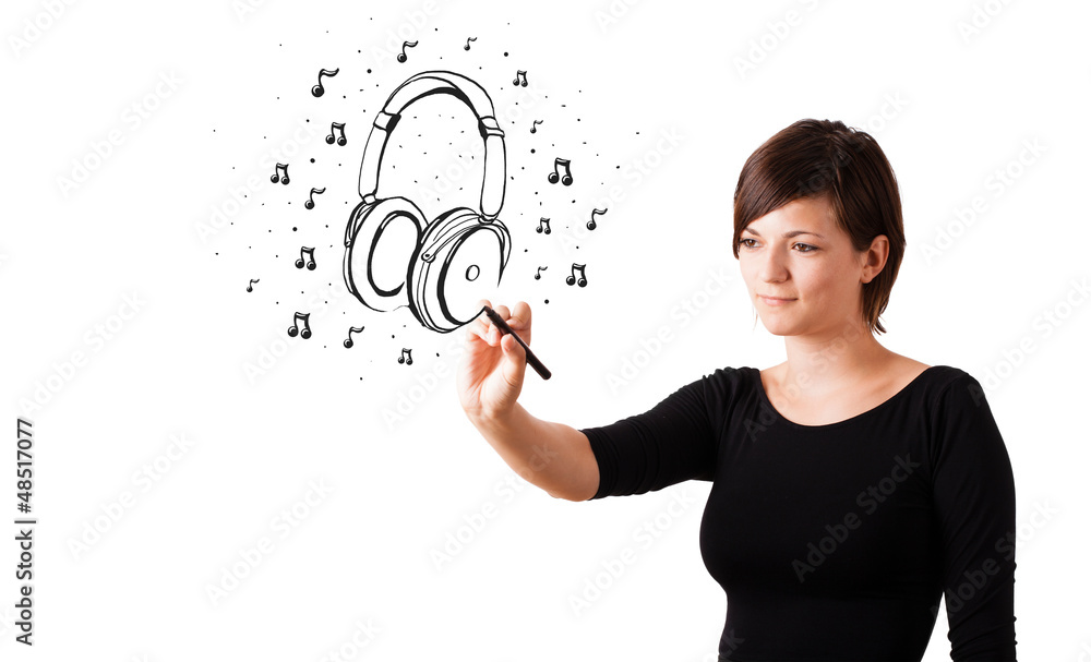 Young girl drawing headphone and musical notes Young girl drawing headphone and musical notes