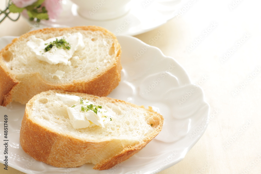 sliced french bread baguette with cream cheese on top sliced french bread baguette with cream cheese on top