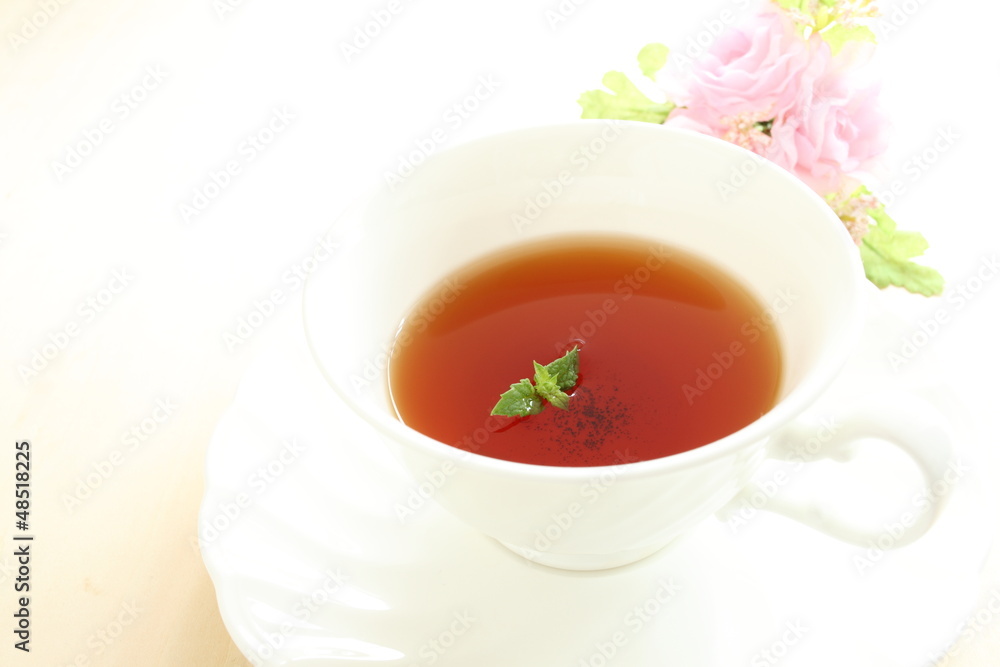 english mint black tea with flower on white background