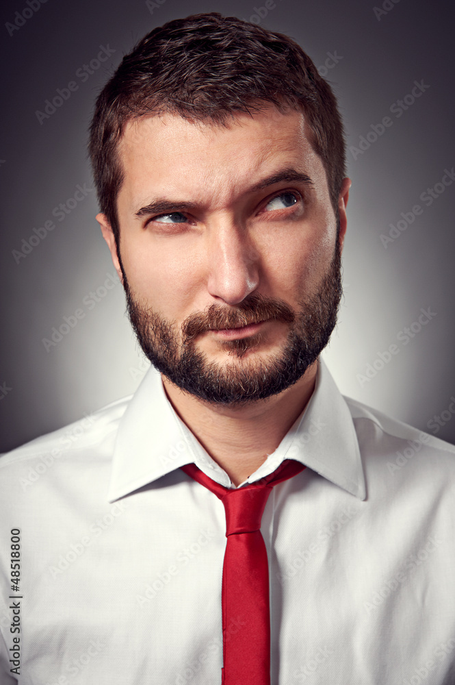 thoughtful man with distrust looking up thoughtful man with distrust looking up