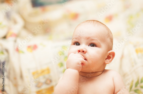 little child eating biscuit