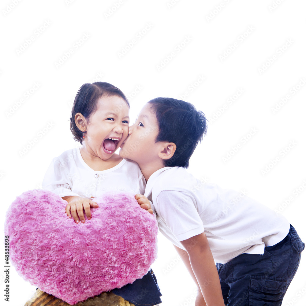 Brother kiss sister on white Stock Photo | Adobe Stock