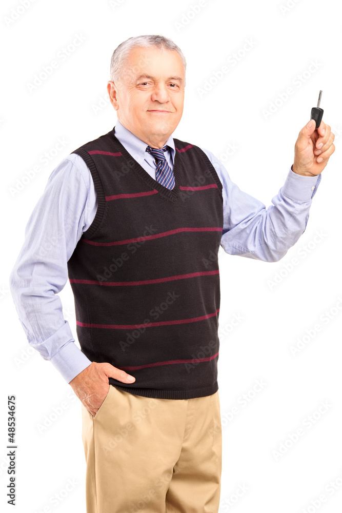 Satisfied mature man holding a car key Satisfied mature man holding a car key