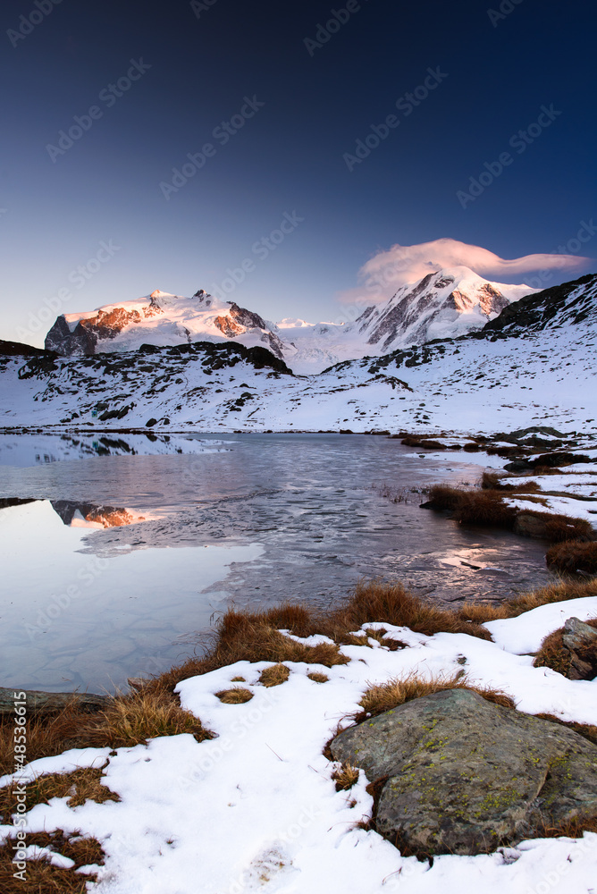 Monte Rosa an Lykamm mountain peak at sunset from Riffelsee