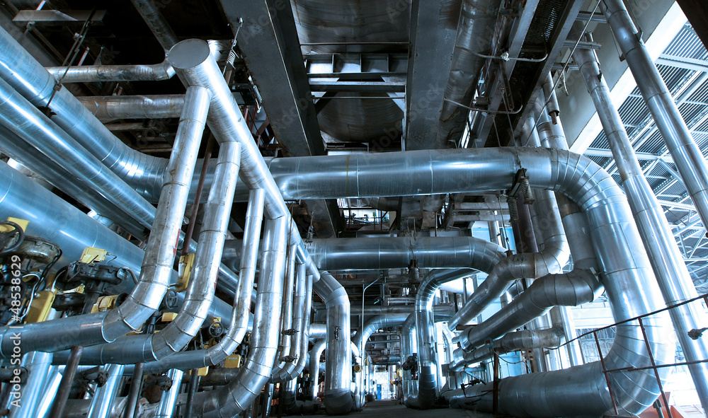 Industrial zone, Steel pipelines and cables in blue tones Industrial zone, Steel pipelines and cables in blue tones