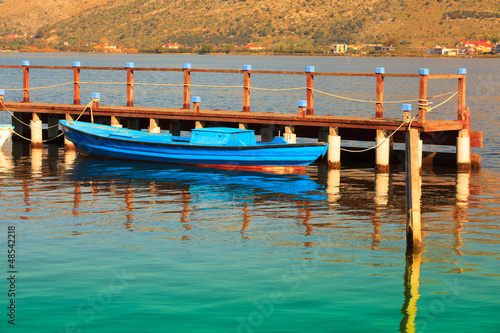 Blue boat with, in Aitoliko sea lake in Central Greece photo