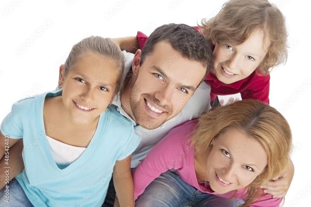 portrait of a family looking up and smiling happily portrait of a family looking up and smiling happily