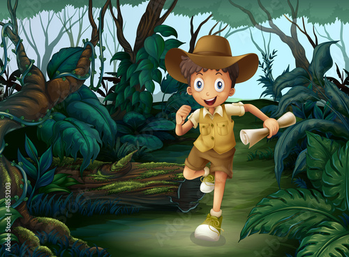 A young boy in the middle of the woods