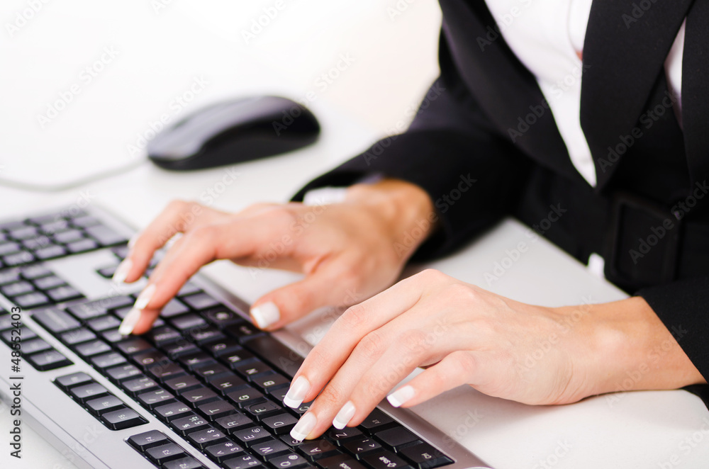 Hands working on the keyboard
