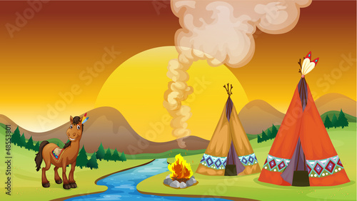 A camp fire and the sunset