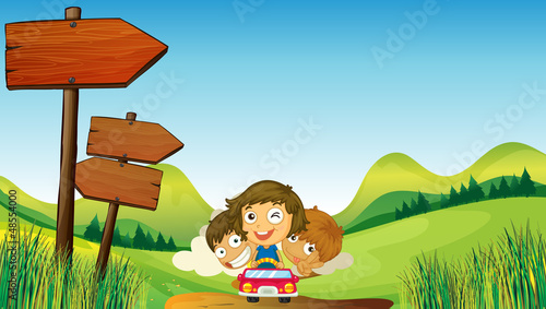 Two boys with a one young girl riding