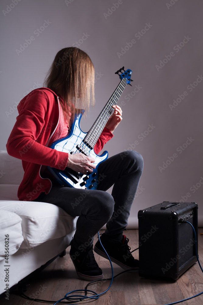 Fototapeta premium young guitarist playing guitar